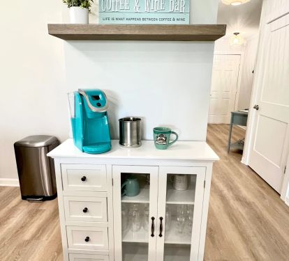 Coffee and Wine Station with Keurig, corkscrew, coffee cups and wine glasses.