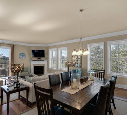 Corner unit with windows galore, wood flooring, wide living space &amp; dining for 8