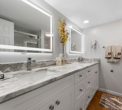 Master bath with double vanity, walk in shower and mirrors with defogger.