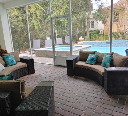 Enjoy comfortable seating in the lanai while overlooking the pool.