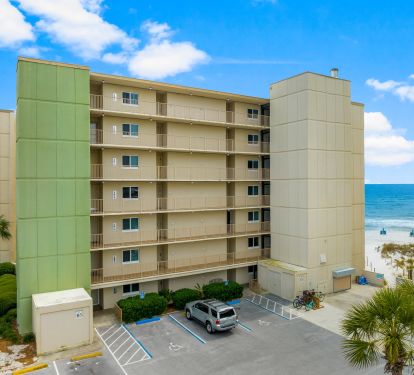 Condo front door on bottom left, path to beach on bottom right.