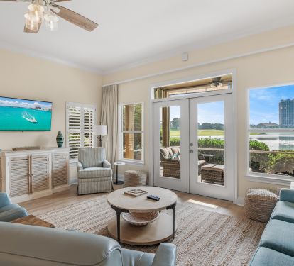Living room has plenty of seating, 55" HDTV, screened in porch
