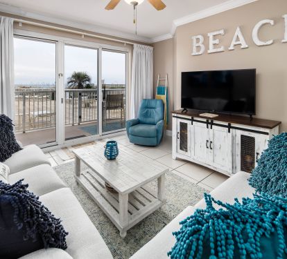 Our Gulf front living room has plenty of seating for family movie nights! 