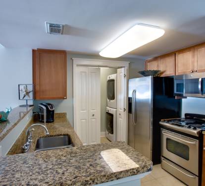 Kitchen is fully equipped with SS Appliances, Granite Countertops, a Keurig, and everything needed for a feast.  Condo also has a large capacity W/D.