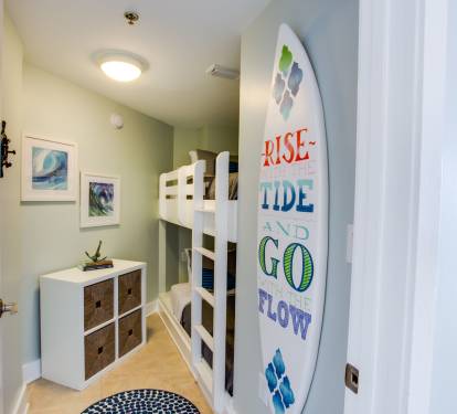 The kiddos are sure to love our surf themed bunkroom with PRIVACY DOOR and nearby half-bathroom