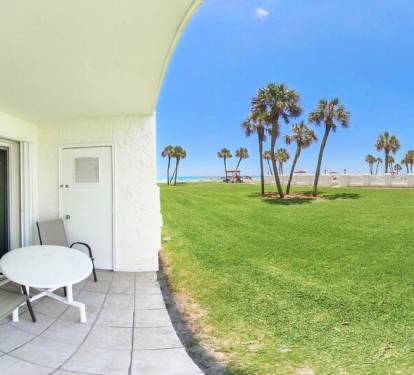 Ground Level patio (left) near beach and pool (right) - El Matador Resort, Okaloosa Island Fort Walton Beach Vacation Rentals