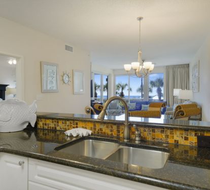 Gather around the open layout of Crescent 110 as laughter flows from the kitchen to the dining and living areas with the beach as your backdrop.