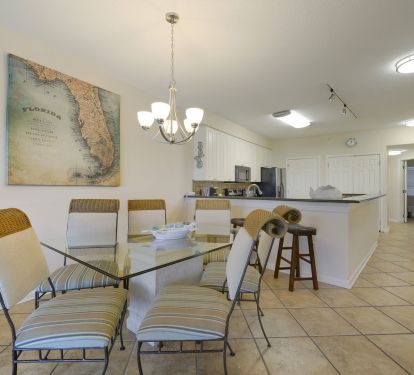 Glass top dining table and inviting lounge area create the perfect setting for your Emerald Coast vacation.