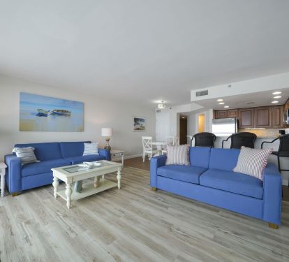 Airy open floor plan connecting living room, dining area, and kitchen in Cabana Club 205