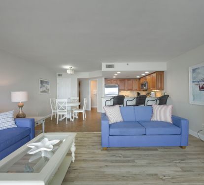 Cabana Club 205 offers a large coastal-inspired great room that seamlessly connects the living room, dining area, and kitchen for effortless vacation living in Destin.