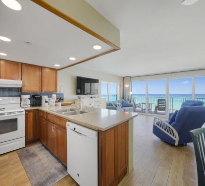 Bright kitchen steps from the balcony and beach
