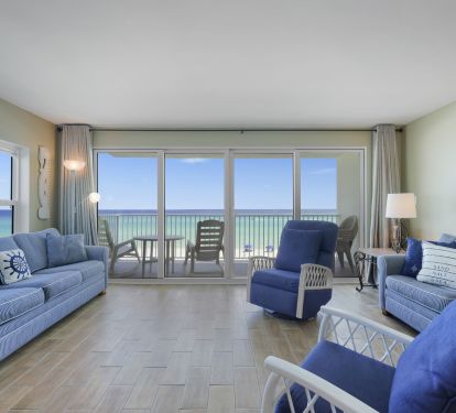 Bright coastal living space with comfortable seating and direct balcony access overlooking Destin-s white sand beaches