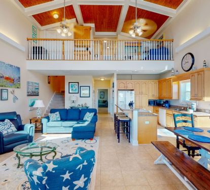 The lofty main floor living space seamlessly integrates the living, dining, and kitchen areas into a social hub, encouraging and promoting quality time with loved ones.