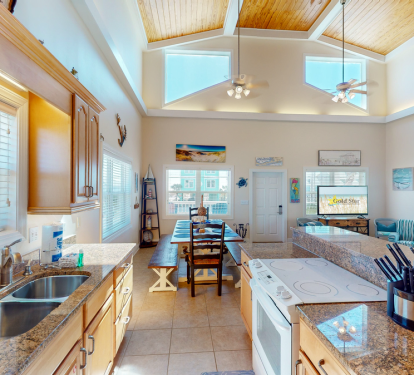 Adjacent to the kitchen, you'll find a charming dining area that comfortably seats ten, creating the perfect setting for memorable family meals.