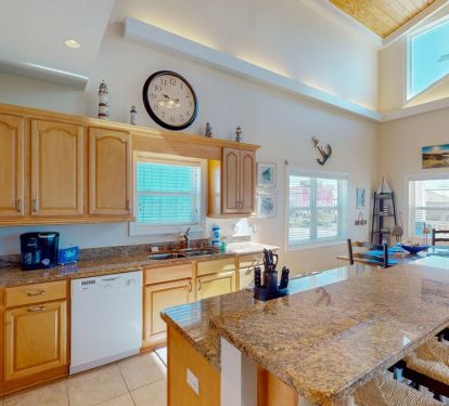 The kitchen island stands in the center of the open living space, serving as the hub around which all your new memories will be made.