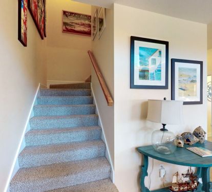 Scattered around the home are subtle reminders to play, relax, and unwind while you're vacationing at the beach.