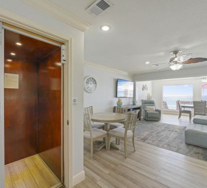 The seamless flow between kitchen, dining, and living areas makes entertaining effortless during your Destin beachfront getaway.