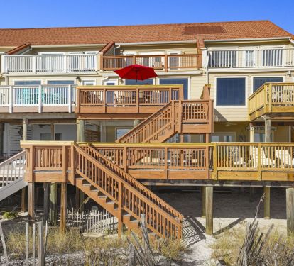 Elevated decks and private stairs lead straight to the sand, making this beachfront retreat feel like your own slice of Destin paradise.