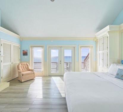 This airy primary suite blends comfort and fun, offering a unique sleeping loft that turns bedtime into part of the vacation adventure.