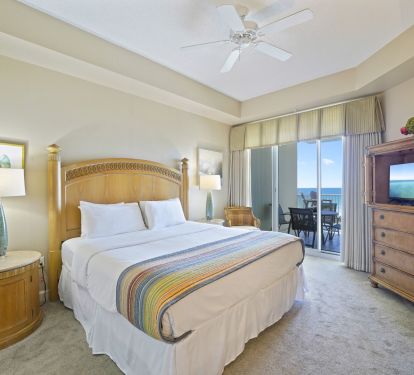 King master bedroom with Gulf-view balcony access at Cabana Club 205