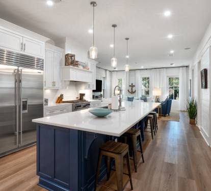 Your gourmet kitchen features marble countertops, stainless steel appliances, and a spacious island perfect for cooking memorable meals together.