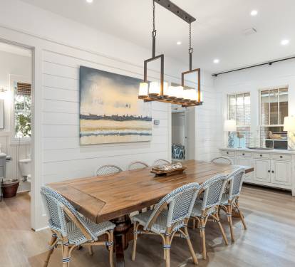 Gather around this beautiful farmhouse dining table where memorable meals and conversations await in your elegant coastal-inspired space.