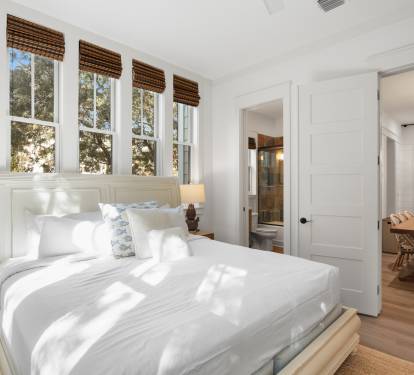 Wake up to gentle sunlight streaming through your windows, creating a serene sanctuary where crisp white linens invite peaceful mornings.