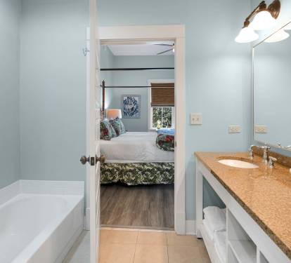 Your spacious bathroom features a soaking tub, granite vanity, and connects seamlessly to your bedroom retreat.