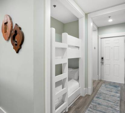 Your kids will love these stylish bunk beds tucked into this cozy nook, creating the perfect sleeping adventure.