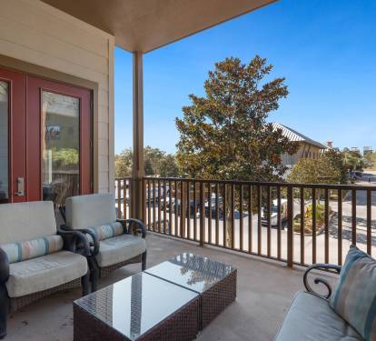 Unwind on your private balcony with plush seating and sweeping views—perfect for morning coffee or evening relaxation.