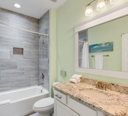 Unwind in your elegant bathroom with granite counters, modern tile work, and a soaking tub perfect for relaxing after your adventures.
