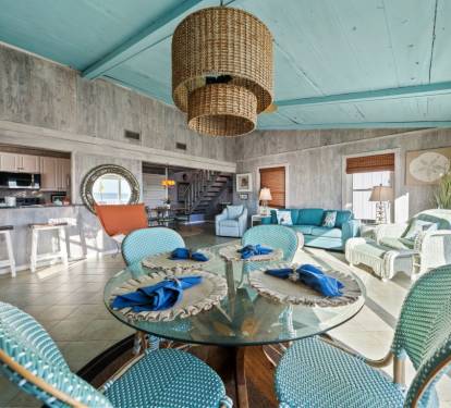 Gather around your bright, airy dining space with coastal blues and natural textures creating the perfect setting for memorable meals together.
