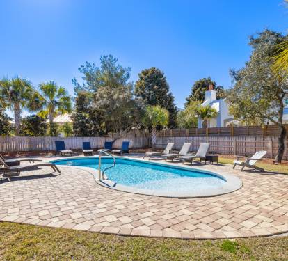 Dive into your private oasis surrounded by swaying palms and sunshine. Lounge poolside while tropical breezes carry your worries away in this fenced backyard paradise.