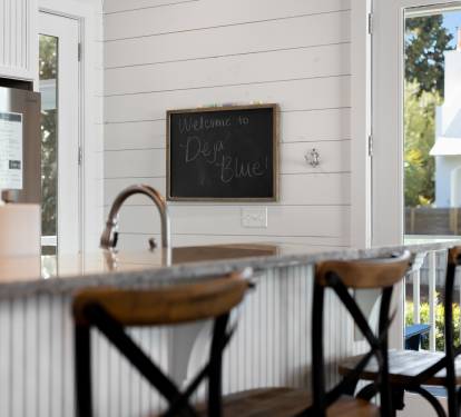 Your bright kitchen welcomes you with modern appliances, granite counters, and charming farmhouse touches for comfortable meal prep.