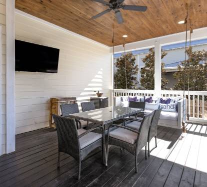 Relax on your private covered porch with dining space, swing seating, and entertainment - perfect for morning coffee or evening wind-down.