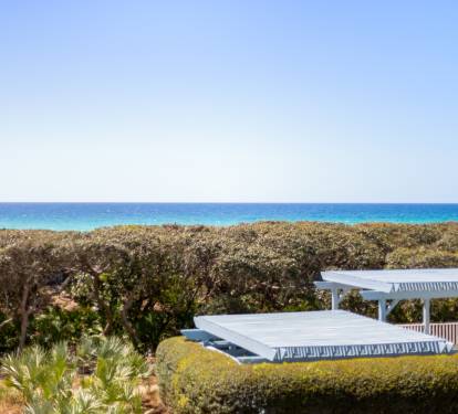 Coastal property with direct sea access features panoramic ocean views and lush native vegetation creating a natural backdrop.