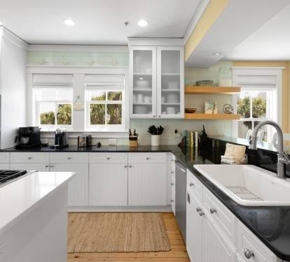 Your spacious gourmet kitchen invites culinary adventures with sleek granite counters, stainless appliances, and warm natural light streaming through pristine windows.