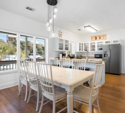 Your spacious dining area opens to a fully equipped kitchen, perfect for family gatherings and meal prep.