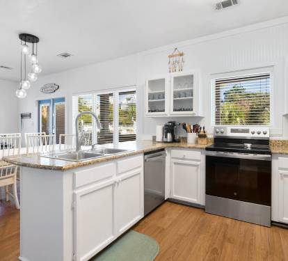 Your bright, open kitchen offers granite countertops, stainless appliances, and a spacious island perfect for preparing meals with family and friends.