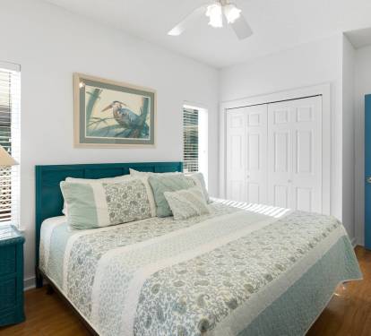 Drift into peaceful sleep in your coastal-themed bedroom, where calming teal tones and soft linens create the perfect sanctuary for rest.