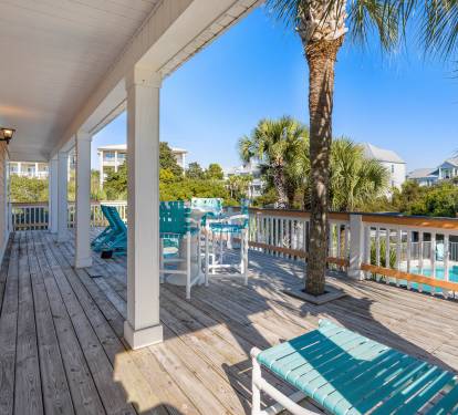 Your private deck offers turquoise pool views and tropical palm shade—perfect for morning coffee or sunset cocktails.