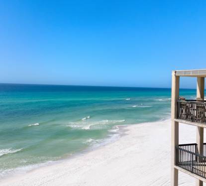 Gulf front property offers stunning Gulf Coast views with pristine white sand beaches and crystal-clear turquoise waters stretching to the horizon.