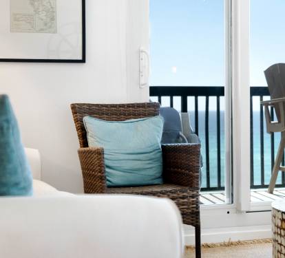 Relax in your bright living space with coastal charm and step onto your private balcony for fresh ocean air.