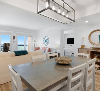 You'll love gathering around this spacious dining table while enjoying ocean views through the bright windows.