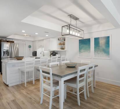 You'll love cooking in this bright, modern kitchen with its spacious island and adjacent dining area—perfect for sharing meals together.