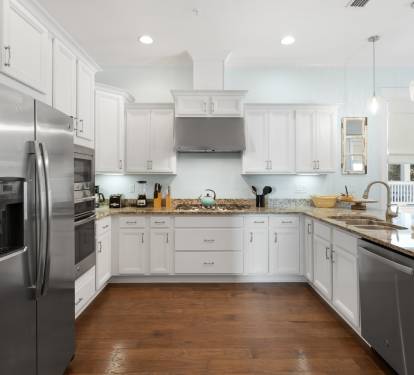 Your gourmet kitchen awaits with gleaming granite counters, stainless steel appliances, and all the space you need to create memorable meals together.
