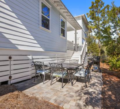 Your private patio offers the perfect spot for morning coffee or evening gatherings under dappled shade.