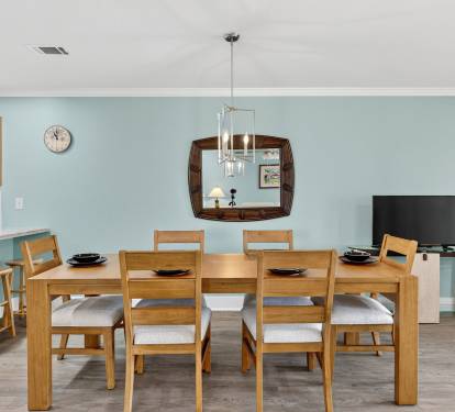 Gather around your spacious dining table for memorable meals, with modern kitchen amenities just steps away and entertainment ready for cozy evenings.
