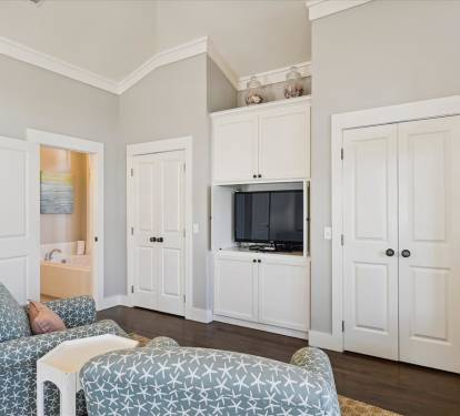Primary King Suite - Flat-Screen TV & Ample Storage