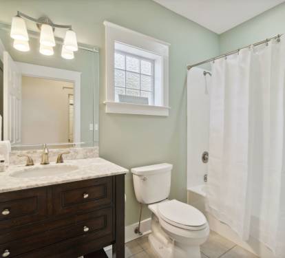 1st Floor Guest Bathroom - Equipped with a Tub/Shower Combination